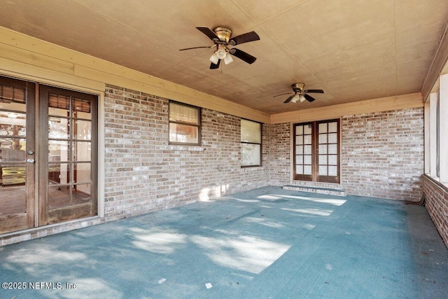 view of patio with french doors and ceiling fan