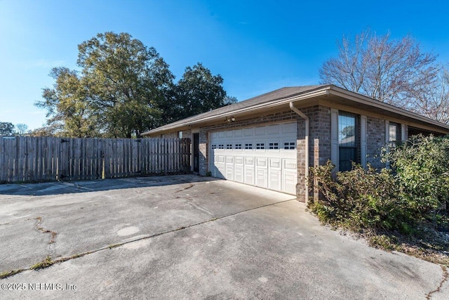 view of side of property featuring a garage