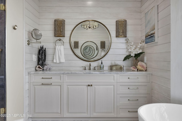 bathroom featuring vanity and a bathing tub