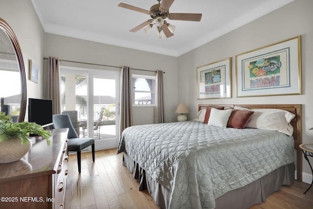 bedroom featuring ornamental molding, ceiling fan, and light hardwood / wood-style floors