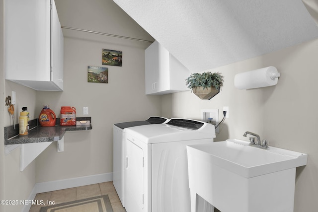 laundry room with sink, cabinets, a textured ceiling, light tile patterned floors, and independent washer and dryer