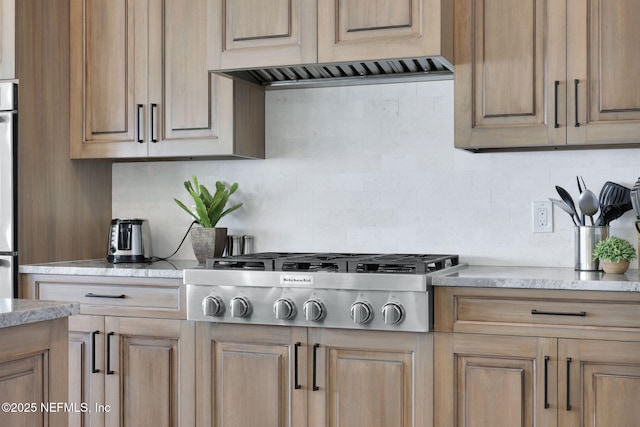 kitchen featuring decorative backsplash and stainless steel gas cooktop