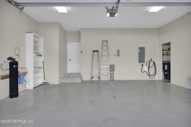 garage featuring a garage door opener and electric panel