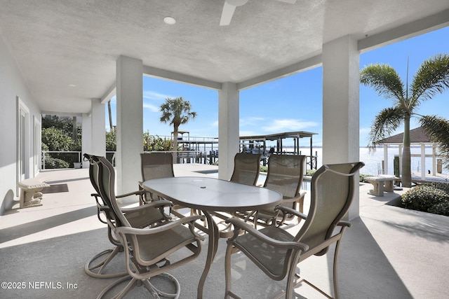 view of patio featuring a water view