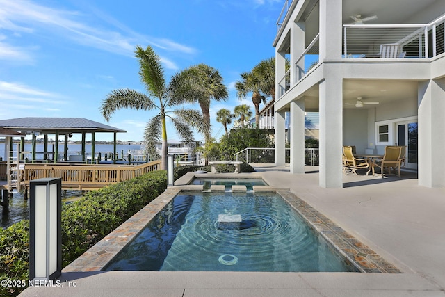 view of pool featuring a gazebo, a patio, ceiling fan, and a water view