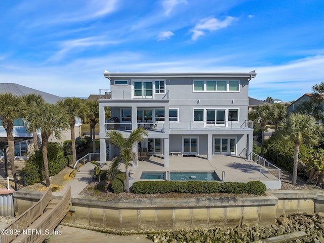 back of house with a patio and a balcony