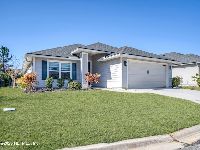 view of front of property featuring a garage and a front yard