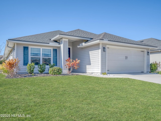 view of front of property with a garage and a front yard