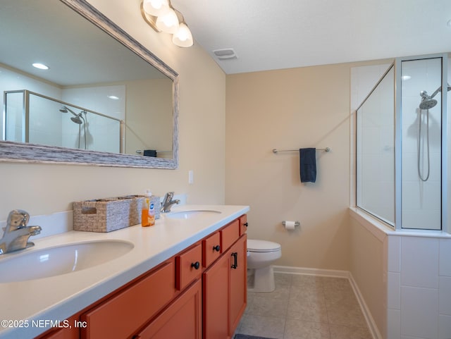 bathroom featuring vanity, toilet, an enclosed shower, and tile patterned flooring