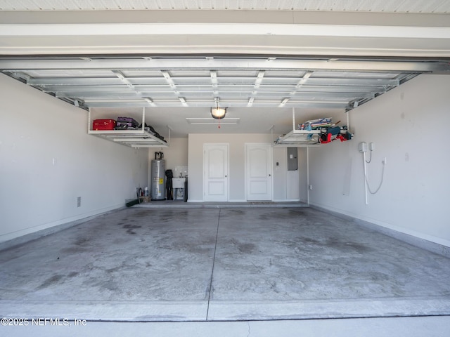 garage with a garage door opener, electric panel, and electric water heater