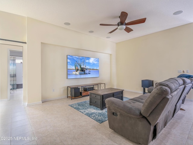 tiled living room featuring ceiling fan