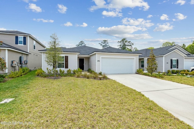 view of front facade with a garage and a front lawn