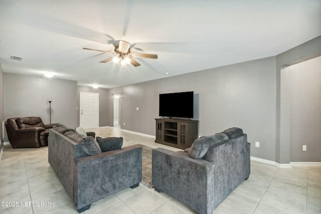 tiled living room featuring ceiling fan