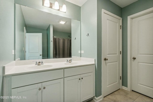 bathroom featuring a shower with curtain, vanity, and tile patterned flooring