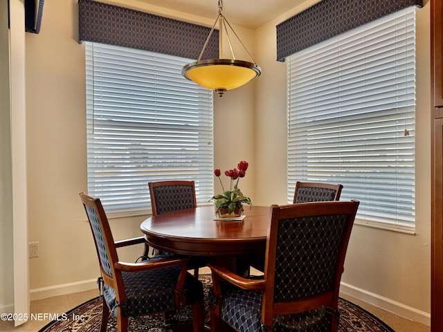 dining space featuring tile patterned floors