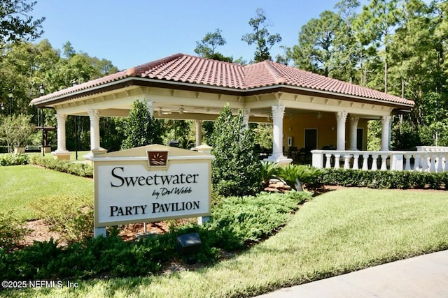 community / neighborhood sign with a lawn