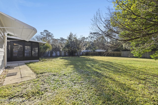 view of yard featuring a sunroom