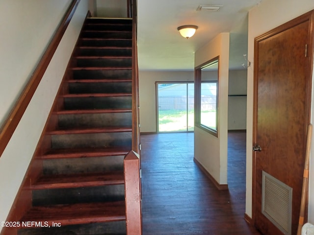 stairs with wood-type flooring