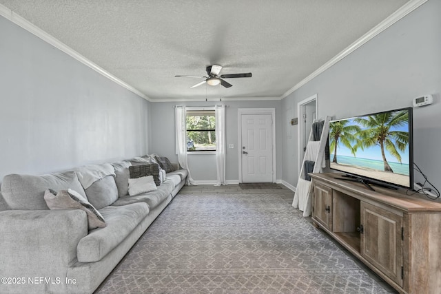 living room with crown molding, a textured ceiling, and ceiling fan