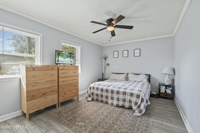 bedroom with crown molding, ceiling fan, a textured ceiling, and light hardwood / wood-style flooring