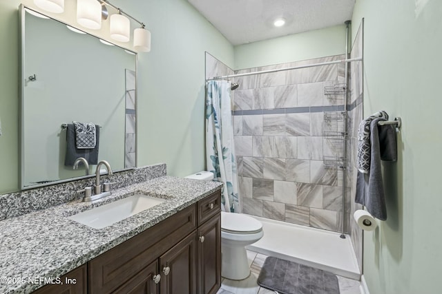 bathroom featuring vanity, toilet, and a shower with shower curtain