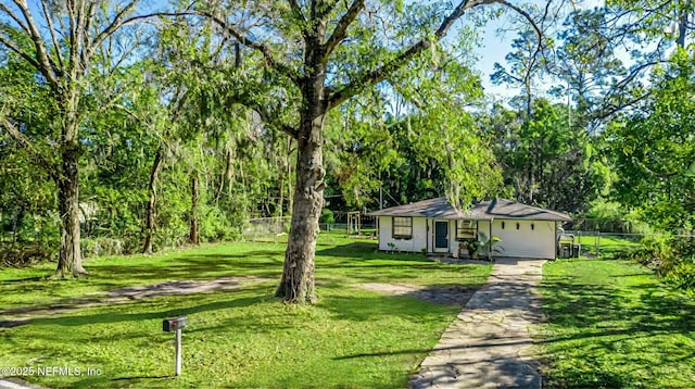 ranch-style home with a front lawn