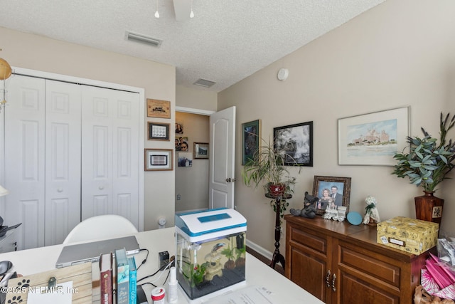 home office with a textured ceiling