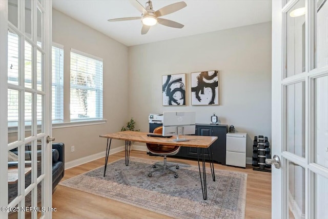 office space featuring light hardwood / wood-style floors, french doors, and ceiling fan