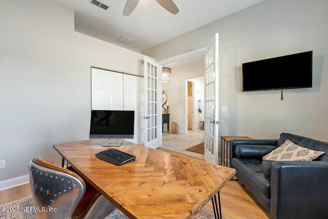 office featuring light hardwood / wood-style flooring, french doors, and ceiling fan