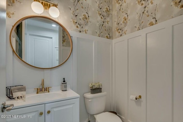 bathroom with vanity and toilet