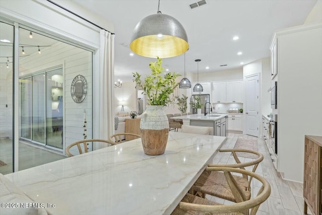 dining space featuring sink