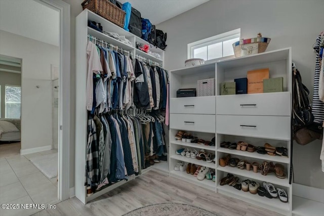 walk in closet featuring light wood-type flooring