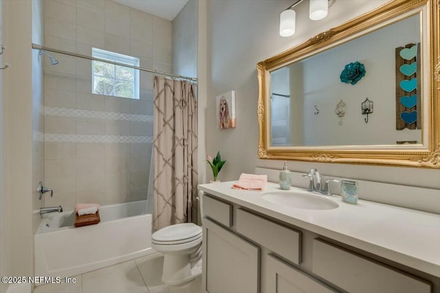 full bathroom featuring vanity, tile patterned floors, toilet, and shower / bath combo