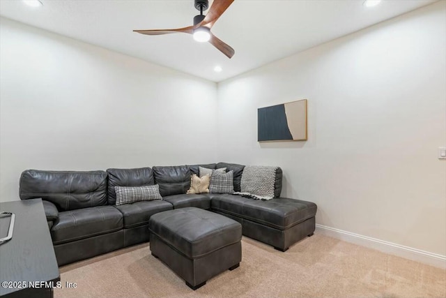 living room featuring light colored carpet and ceiling fan