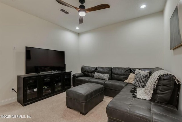 living room with light colored carpet and ceiling fan