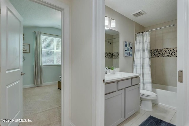 full bathroom with tile patterned floors, toilet, a textured ceiling, vanity, and shower / bath combination with curtain