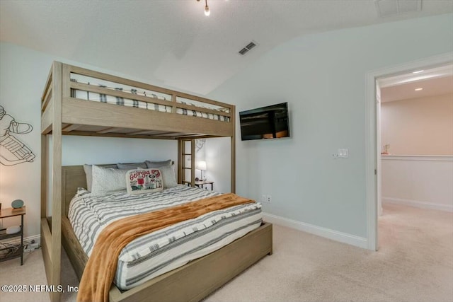 bedroom with lofted ceiling and carpet