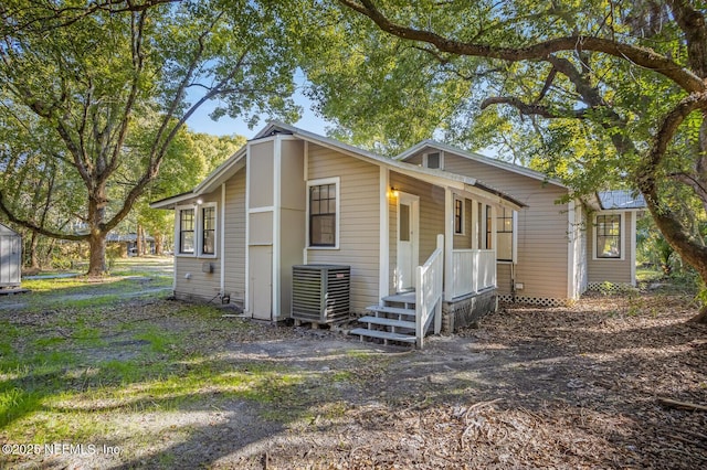 view of side of property with cooling unit