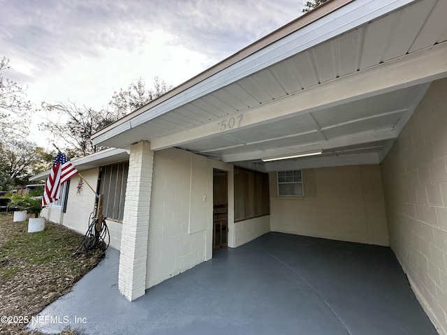 exterior space featuring a carport