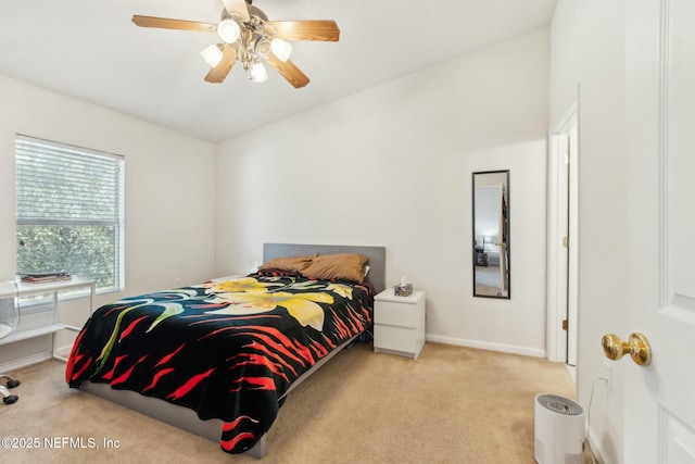 bedroom featuring ceiling fan and light carpet