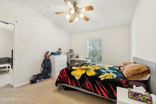 carpeted bedroom featuring ceiling fan and vaulted ceiling