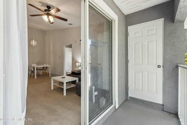 bathroom featuring ceiling fan with notable chandelier