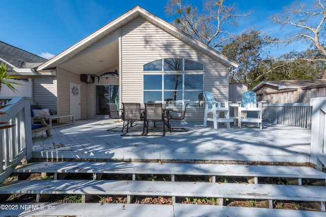 back of house featuring a deck