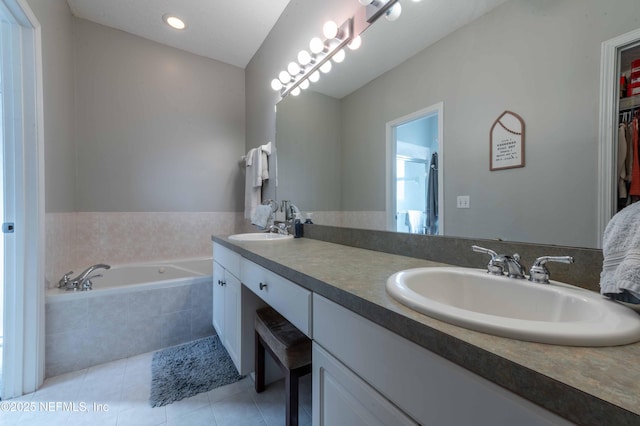 bathroom featuring vanity, shower with separate bathtub, and tile patterned floors