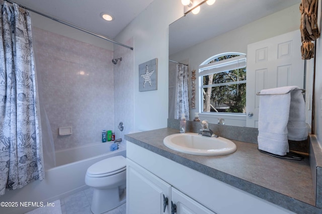 full bathroom featuring shower / bath combo, vanity, tile patterned floors, and toilet