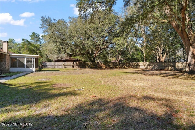 view of yard with a sunroom