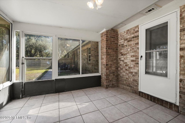 unfurnished sunroom with a wealth of natural light