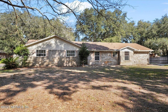 back of house with a lawn