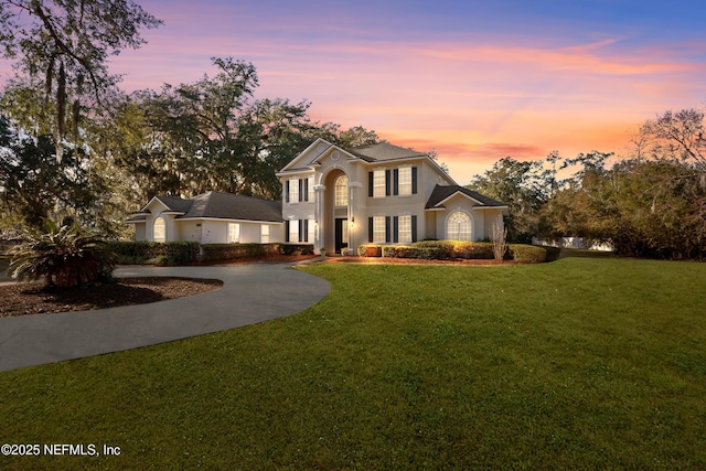 view of front of property with a yard