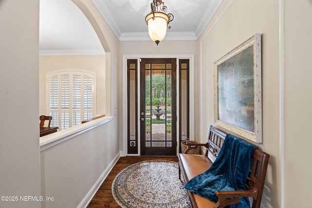 entryway featuring dark hardwood / wood-style flooring and ornamental molding